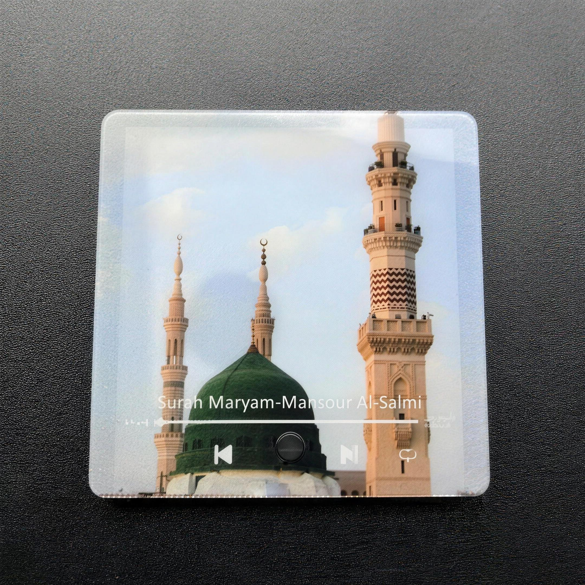 The Surah Player held in one hand